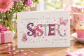 Happy Birthday to a Lovely Sister greetings card – vibrant butterfly and stars embellished design in pink and purple